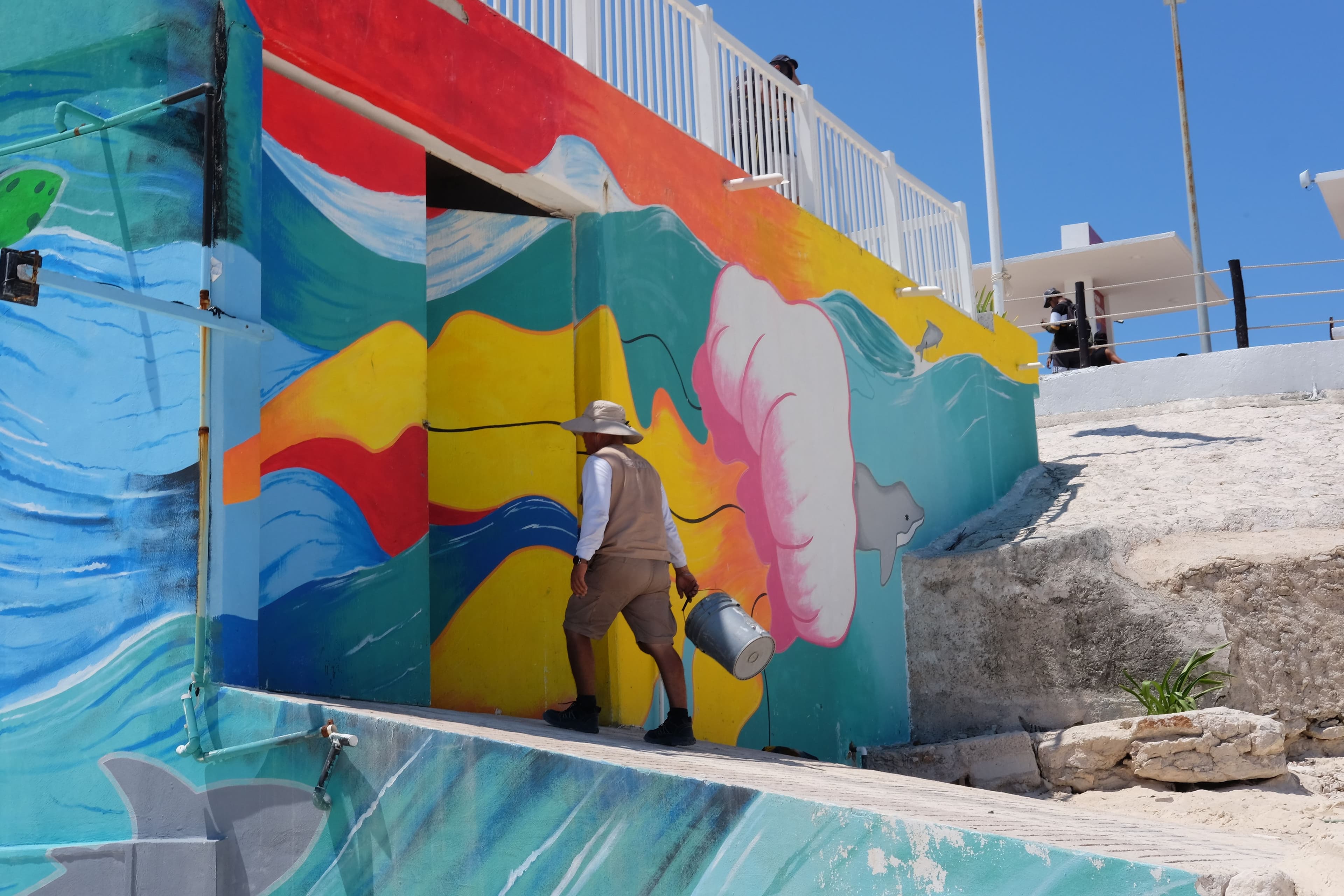 Worker and colored wall